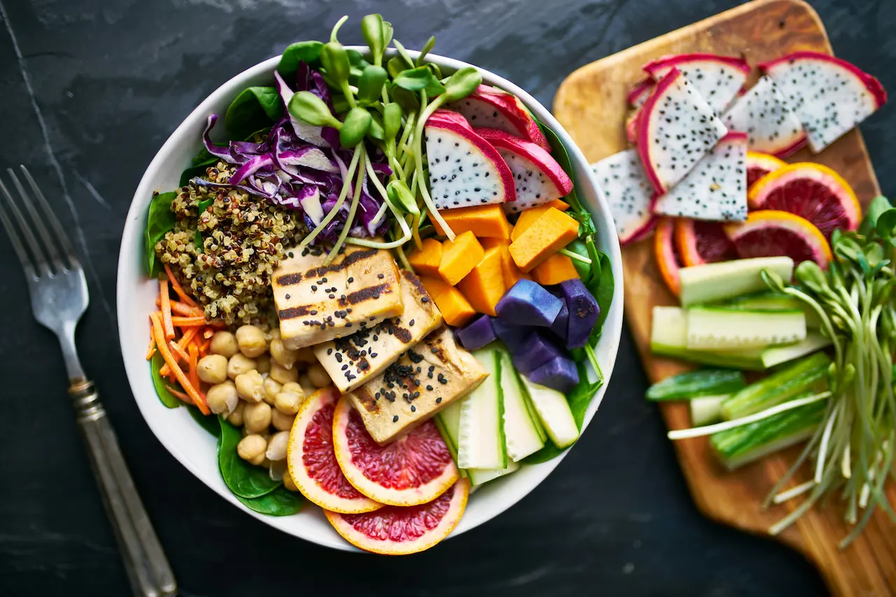 A vibrant and colorful bowl of fresh, healthy plant-based ingredients